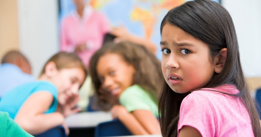 Female elementary school pupil being bullied